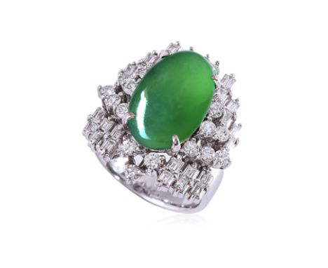 A TYPE A JADEITE AND DIAMOND RING Featuring a type a jadeite cabochon measuring approximately 15.82 x 9.81 x 5.43mm, mounted 