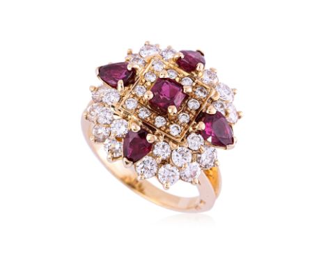 A VIVID RUBY AND DIAMOND RING
Featuring square and pear cut rubies totalling approximately 1.80 Cts, mounted in a yellow gold