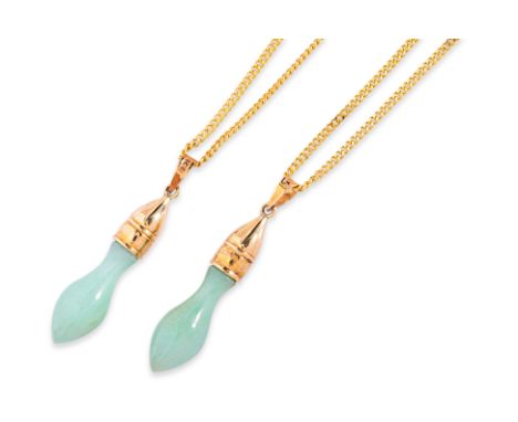 A PAIR OF JADE PENDANTS ON HIGH KARAT GOLD CHAINS
Featuring a pair of carved jade piece, each mounted in a setting marked '75