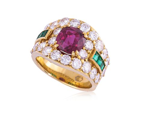 A RUBY, EMERALD AND DIAMOND RING
Featuring a cushion cut ruby weighing approximately 2.70 Cts, mounted in a yellow gold setti
