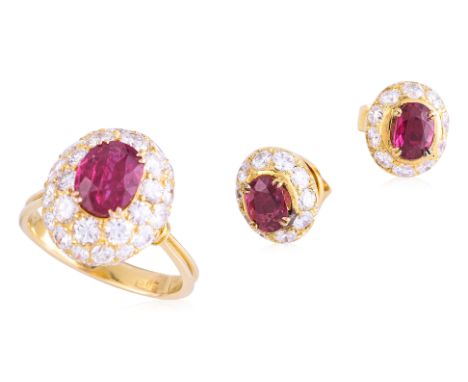 A RUBY AND DIAMOND RING WITH A PAIR OF SIMILAR EARRINGS
Featuring an oval shaped ruby weighing approximately 1.20 Cts, mounte