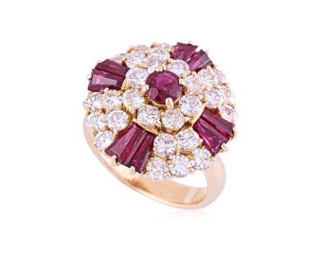 A VIVID RUBY AND DIAMOND RING
Featuring round and tapered baguette cut rubies totalling approximately 1.75 Cts, mounted in a 