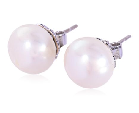 A PAIR OF CULTURED PEARL STUDS BY LARRY JEWELRY
Featuring a pair of button shaped cultured pearls measuring approximately 11m