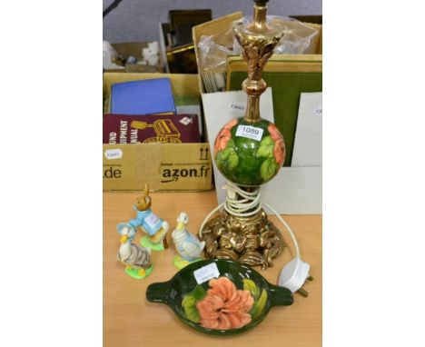 A Moorcroft twin handled dish and a Moorcroft gilt metal mounted table lamp both in the Hibiscus pattern together with three 