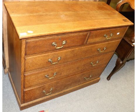 An oak four height chest of drawers