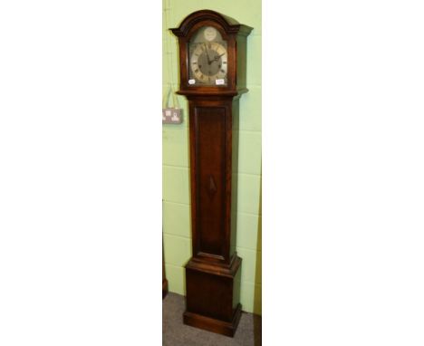 A 1930s oak chiming small longcase clock, chiming on gong rods