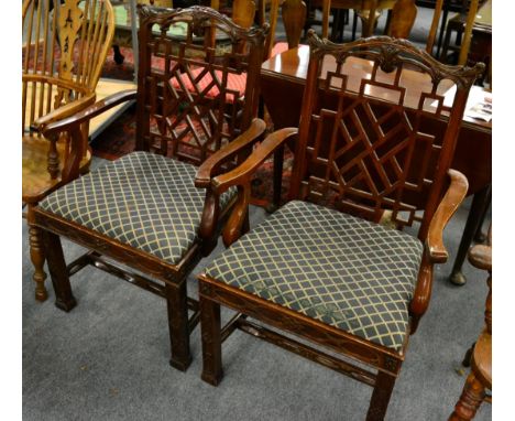 A pair of reproduction Chinese Chippendale style chairs with cockpen backs 