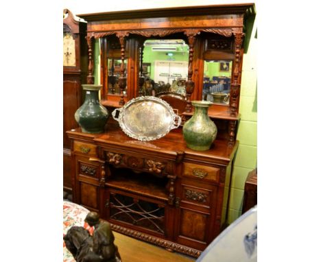 A late Victorian carved walnut mirror back sideboard, with superstructure back, the base of breakfront form with central draw