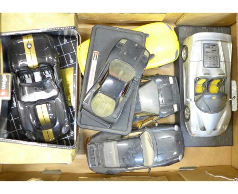 Five Burago and one Maisto die-cast model vehicles 