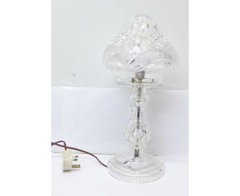 A crystal glass table lamp,&nbsp;tiny chip to the underneath of the shade, inside the rim.
