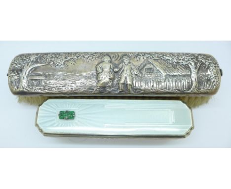 A silver brush and a silver and enamel brush 