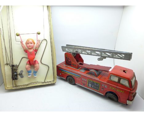 A tin plate toy fire engine and a Branko Japanese mechanical acrobat, boxed 