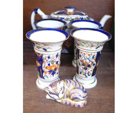 A Crown Derby teapot, four Crown Derby vases and a Royal Crown Derby paperweight, teapot crazed, vases restored 