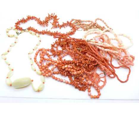 Two 9ct gold and coral necklaces, eight other coral necklaces, a coral coloured round bead necklace and two others with mothe