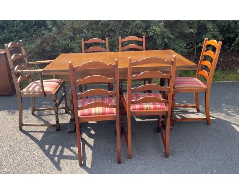 Oak draw leaf table and 6 ladder back chairs, one is a carver, table measures approx 146cm length 90cm wide 77cm tall