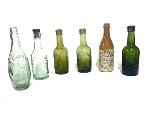 Selection of vintage glass advertising bottles 