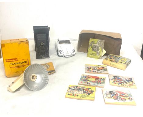 Vintage Porsche Burago model car, Vintage Noddy books with Robinsons character, selection of vintage cameras 