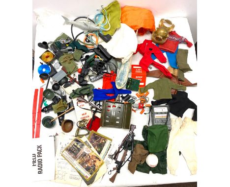 Large selection of vintage Action man accessories to include guns, helmets, ski's radio packs, clothing etc 