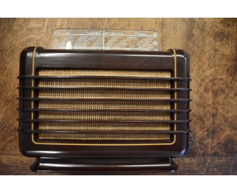 VINTAGE PHILIPS BAKELITE RADIO. A very early bakelite radio. 1940s Art Deco design Philips 209U 'mini' model in dark brown ba
