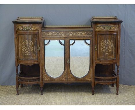 A 19thC rosewood chiffonier with central bevelled mirror doors flanked by barrel fronted drawer, cupboard and galleried shelf