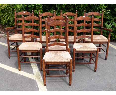 A set of 8 (6+2) oak ladder back rush seated dining chairs