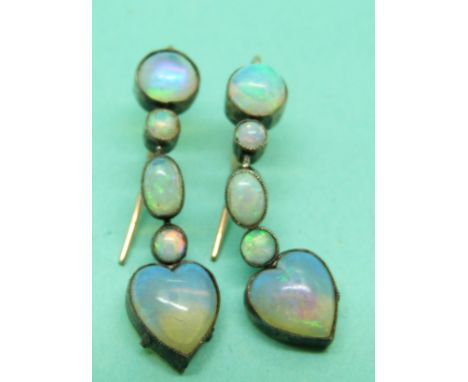 A pair of Victorian drop earrings set with oval and circular opal cabochons with a heart opal cabochon to the bottom. 