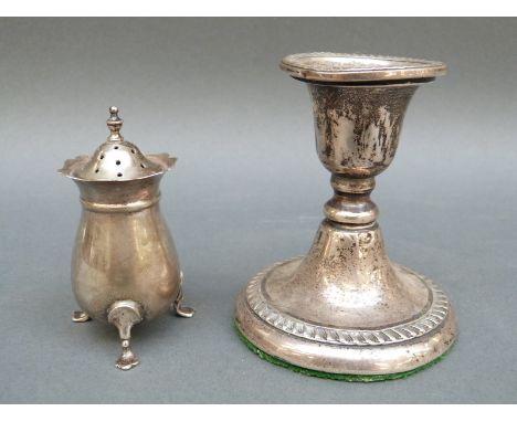 A hallmarked silver open salt, silver pepper and a candlestick