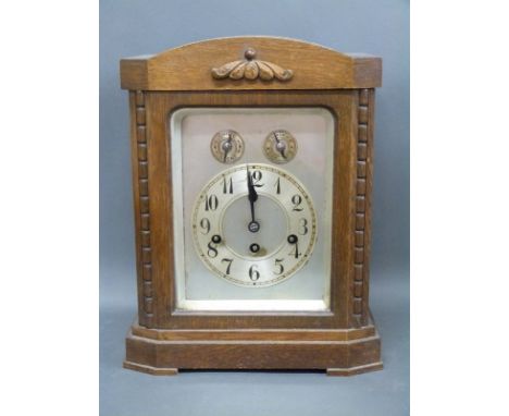 A 20th Century Wurtemberg oak mantel clock with chime silent facility and Arabic silvered dial