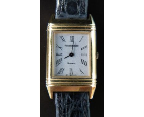Jaeger LeCoultre Reverso 18ct gold ladies wristwatch with black hands and Roman numerals, on black leather strap, case size 1