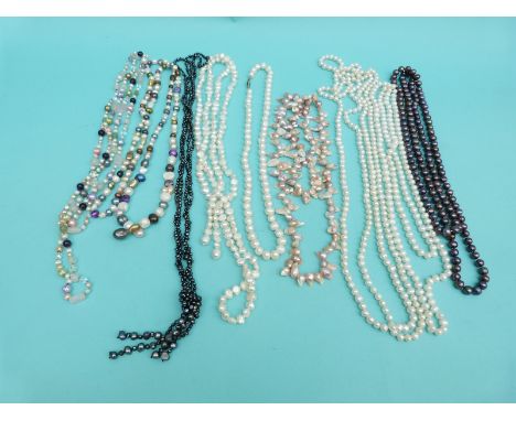 Nine pearl necklaces including freshwater pearls in different colours, some extremely long examples