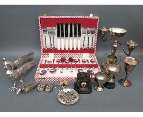 A quantity of silver plated items including decorative table pheasants, novelty duck cruets, cased cutlery, presentation cups