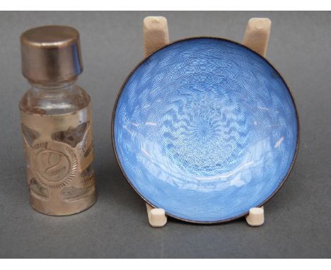 A white metal and guilloche enamel dish marked 925, diameter 5cm and a Mexican white metal mounted scent bottle 