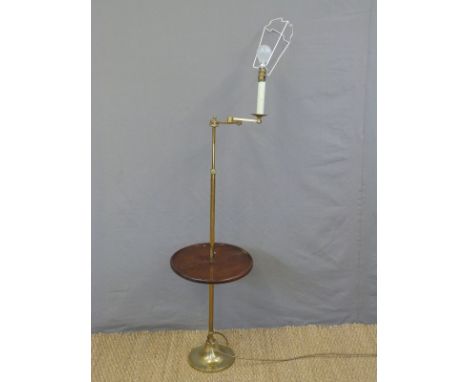 A brass library lamp with tray table and articulated arm, height approx 128cm