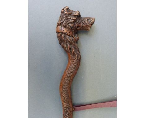 A Victorian carved ladies walking stick with dog's head finial and opening mouth, length 87cm