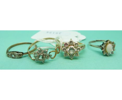 Two 9ct gold rings set with cubic zirconia, 9ct gold ring and a silver ring set with an opal 