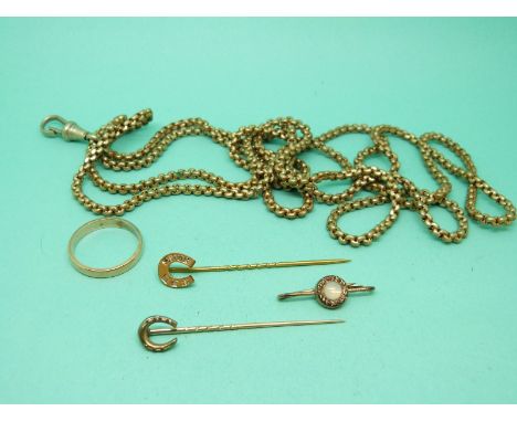 A 9ct gold horse shoe stick pin set with diamonds, a yellow metal wedding band, another horseshoe stick pin and a guard chain