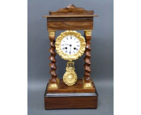 A 19th century French mantel clock supported on four barley twist columns, the enamelled Roman dial with Breguet style hands,