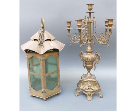 An Art Nouveau brass lantern with wavy top, height 50cm, together with a brass candelabra, height 60cm 