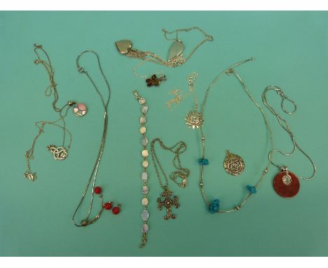 A silver filigree Maltese cross, a silver brooch in the form of a Canadian maple leaf set with enamel, tigers eye pendant, si