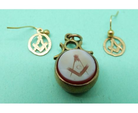 A yellow metal intaglio seal with Masonic emblem with compass verso together with a pair of 9ct gold masonic earrings
