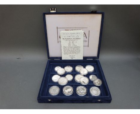 A case containing four silver 'Official Silver Coins of China' with certificates, together with a further Chinese 1 dollar an