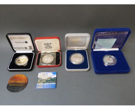 Four crown sized silver coins to include Lord of the Rings 2003, Millennium etc