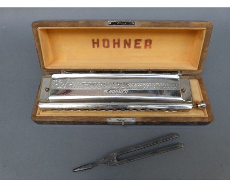 Hohner 64 Chromonica 4 chromatic octaves harmonica by Hohner and a tuning fork in key of C