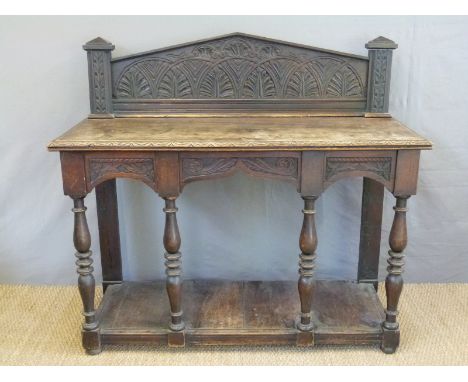 A 19th century carved oak buffet with undershelf W142 x D56 x H130cm