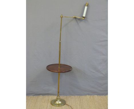 A brass library lamp with tray table and articulated arm, height approx 128cm