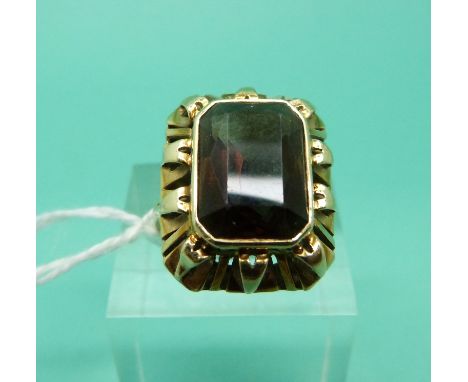A yellow metal ring marked 585 set with a smoky quartz, weight 6.1g (Size N)