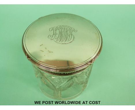 A Fabergé silver topped dressing table pot with ribbon decoration and banding around the top and line and floral decoration t