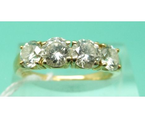 An 18ct gold ring set with four round brilliant cut diamonds, signed Kutchinsky, total diamond weight approximately 2.1cts (S