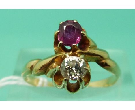 A 14ct gold ring set with a diamond and a ruby (Size O)