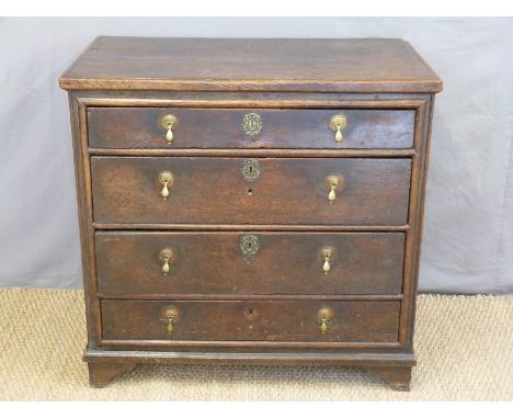 An antique oak chest of four straight graduated drawers raised on bracket feet, W91 x D56 x H87cm